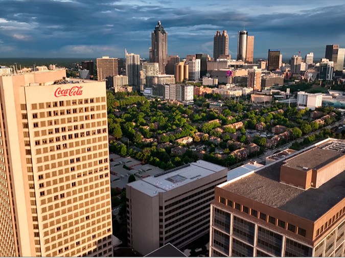 A view of the Atlanta skyline with Coca-Cola headquarters in the foreground