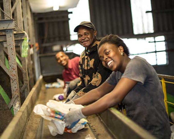 Trash and recyclables are sorted on a conveyor belt